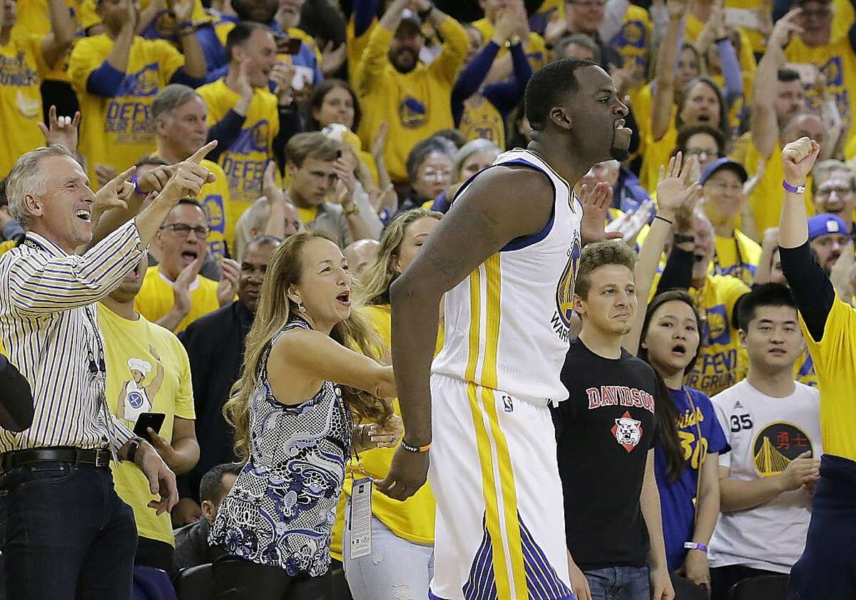 Golden State Warriors forward Draymond Green celebrates in front of fans during the second half of Game 1 of a first-round NBA basketball playoff series against the Portland Trail Blazers in Oakland on Sunday, April 16, 2017.