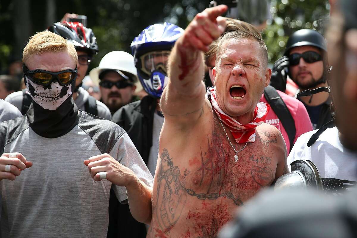BERKELEY, CA - APRIL 15: Trump supporters face off with protesters at a "Patriots Day" free speech rally on April 15, 2017 in Berkeley, California. More than a dozen people were arrested after fistfights broke out at a park where supporters and opponents of President Trump had gathered. (Photo by Elijah Nouvelage/Getty Images)