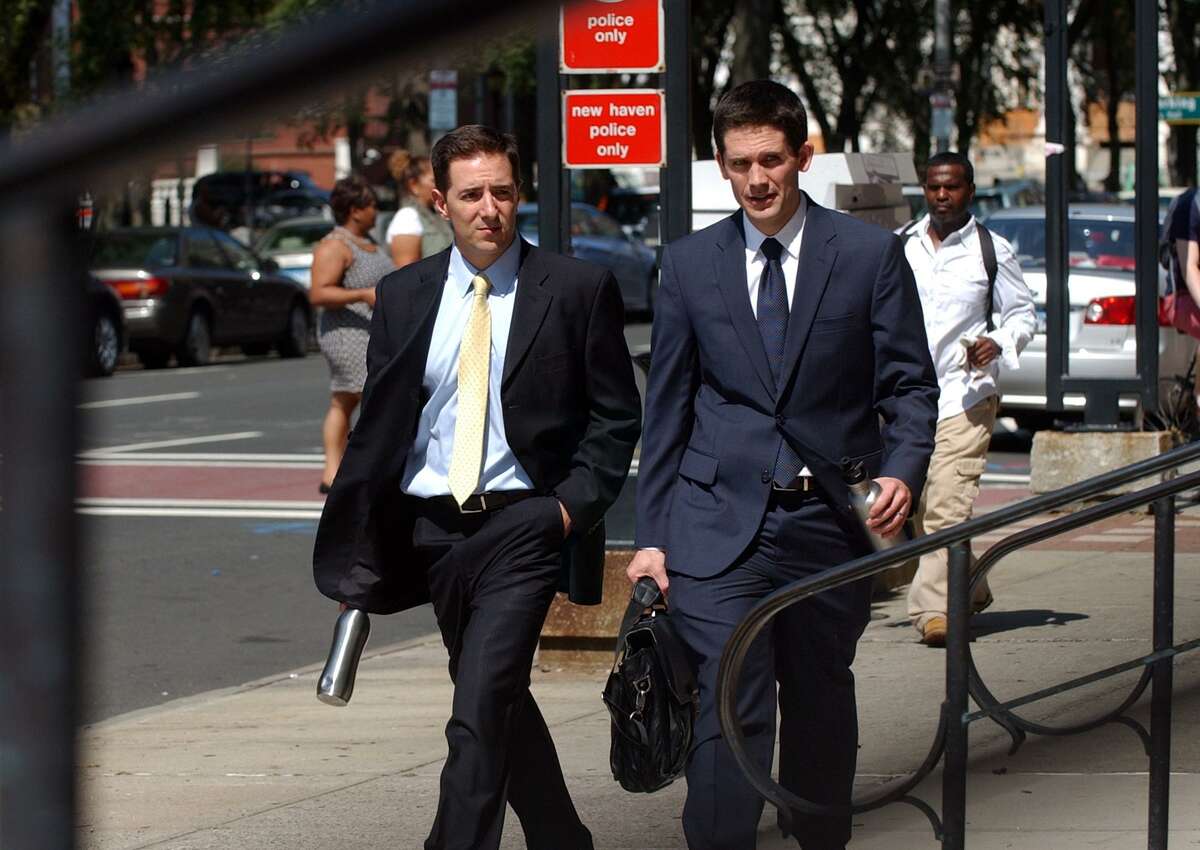 Prosecutors Chris Mattei, left, and Liam Brennan, enter the Federal Courthouse after a break during day three in the John Rowland trial in downtown New Haven, Conn. on Friday September 5, 2014.