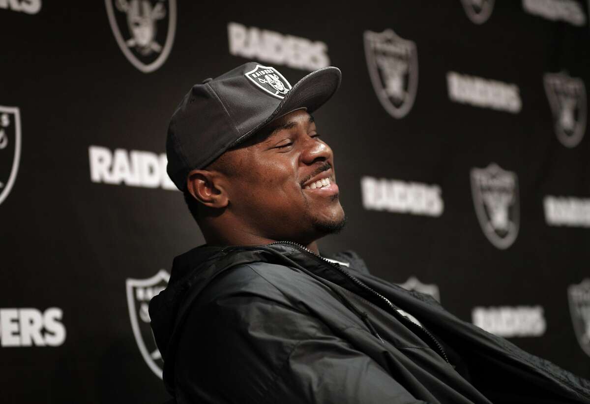 Khalil Mack laughs at a joke as several Oakland Raiders spoke to the press following their first off-season workouts at the Raiders facility in Alameda, Calif., on Monday, April 17, 2017.