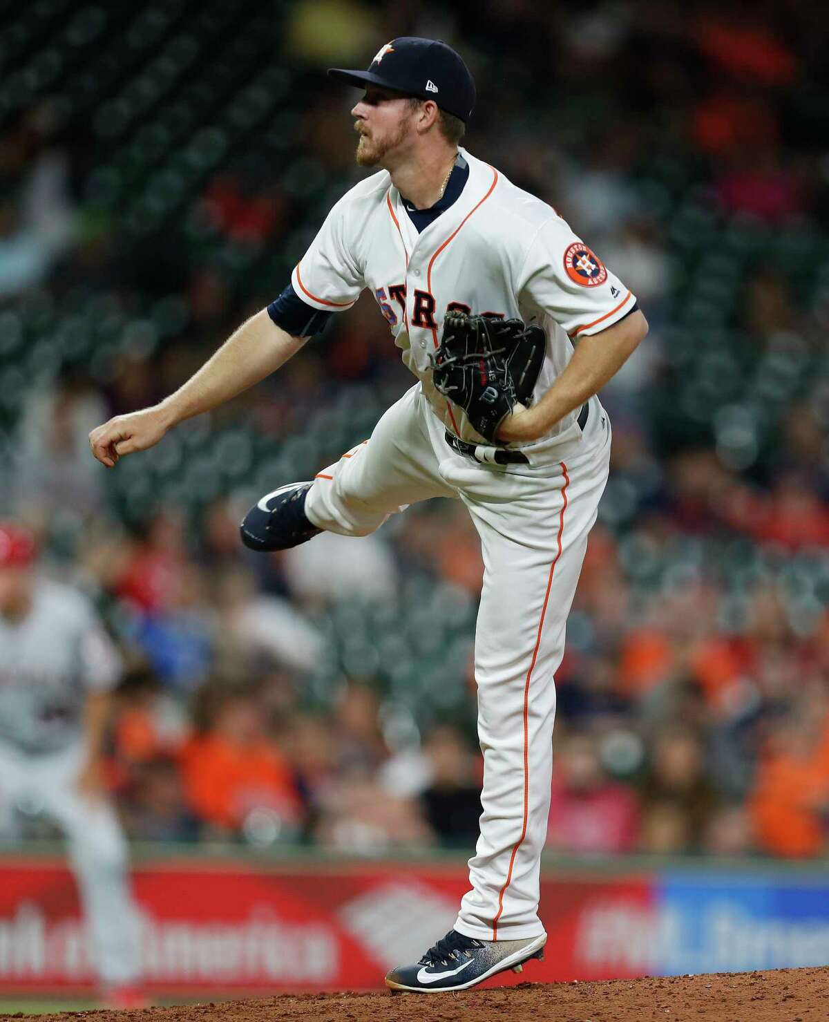 Houston Astros relief pitcher Chris Devenski (47) pitches during the sixth inning of an MLB baseball game at Minute Maid Park, 2017, in Houston.