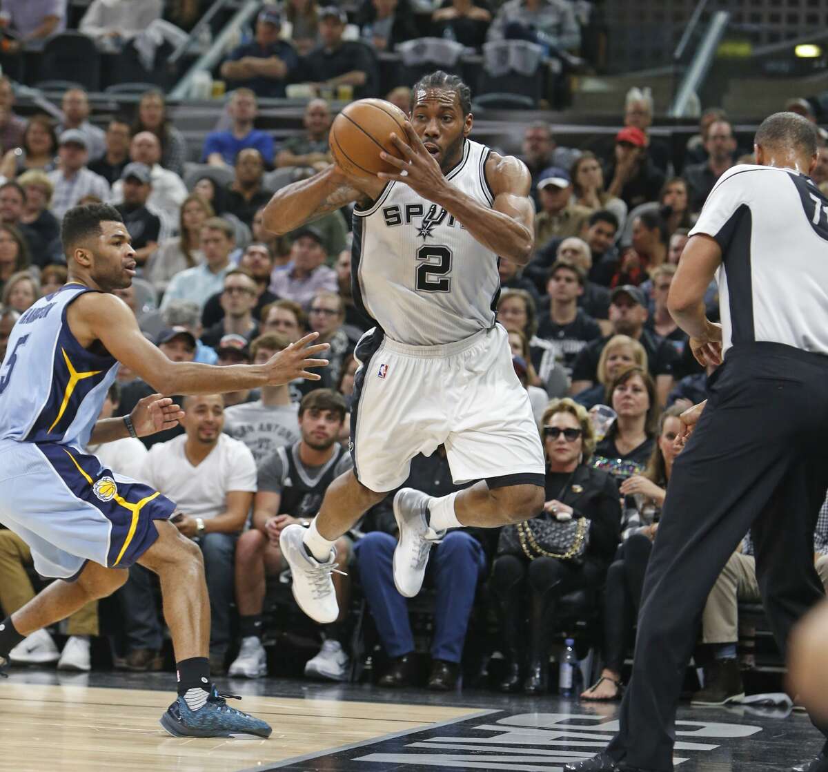 SAN ANTONIO,TX - APRIL 17: Kawhi Leonard #2 of the San Antonio Spurs tries unsuccessfully to save the ball from going out of bounds against the Memphis Grizzlies in Game Two of the Western Conference Quarterfinals during the 2017 NBA Playoffs at AT&T Center on April 17, 2017 in San Antonio, Texas. NOTE TO USER: User expressly acknowledges and agrees that , by downloading and or using this photograph, User is consenting to the terms and conditions of the Getty Images License Agreement. (Photo by Ronald Cortes/Getty Images)