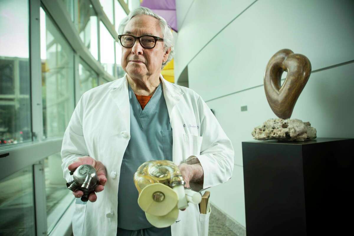 Dr. Bud Frazier poses for a portrait at the Texas Heart Institue on Monday, March 6, 2017, in Houston. Frazier holds a BiVACOR total Artificial Heart, that is in development, on the left; and an AbioCor implantable replacement heart from 2001. ( Brett Coomer / Houston Chronicle )