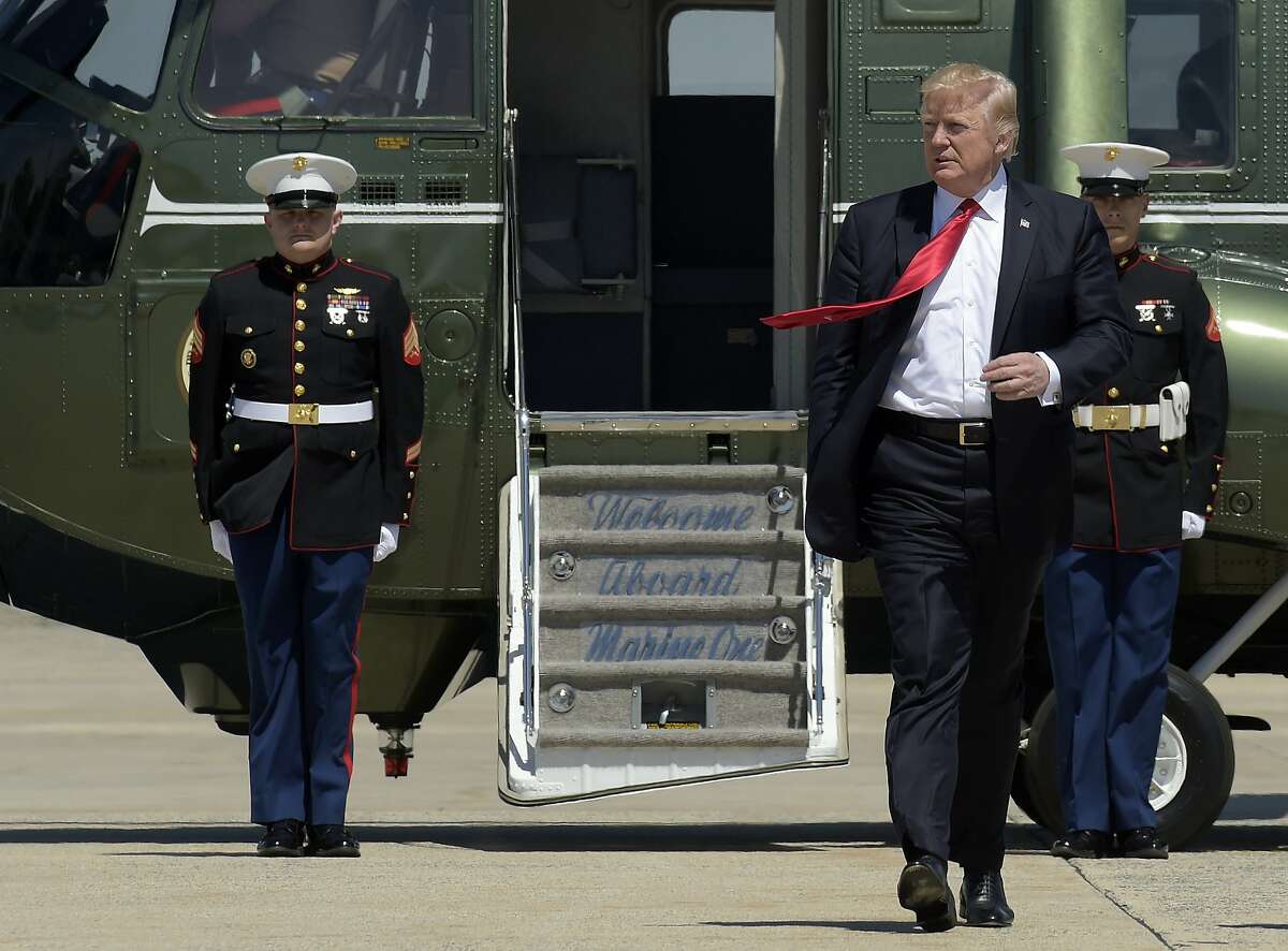 President Donald Trump walks towards Air Force One at Andrews Air Force Base in Md., Tuesday, April 18, 2017. Trump is heading to Kenosha, Wis., to visit the headquarters of tool manufacturer Snap-on Inc., and sign a an executive order that seeks to make changes to a visa program that brings in high-skilled workers. (AP Photo/Susan Walsh)