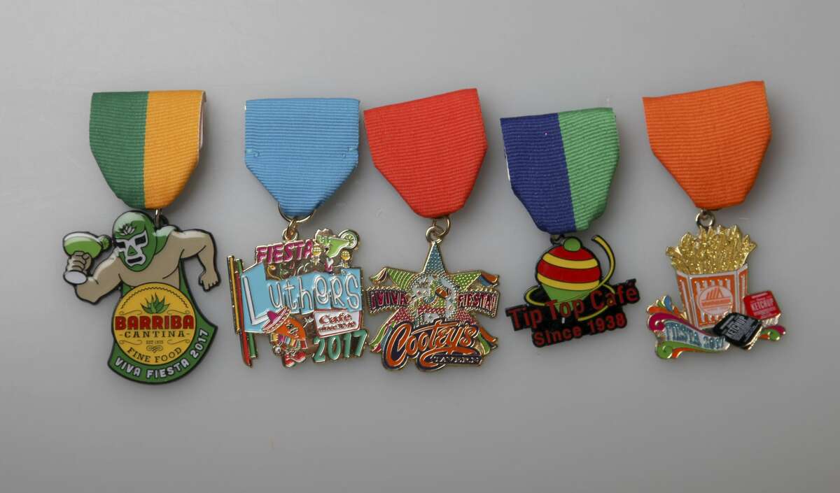 Check out the 400-plus medals submitted in the 2017 San Antonio Express-News Fiesta Medals Contest. From left, Barriba Cantina, 111 W. Crockett on the Riverwalk, $8; Luther's Bar & Cafe; Cootey?’s Tavern, $5, 8318 Jones Maltsberger; Tip Top Café, $50, 2814 Fredericksburg Road, includes 100 Club of San Antonio Fiesta medal, two $20 gift certificates, while supplies last; and Whataburger, $9.99, Whataburger.com.