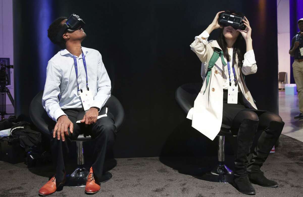 Inside the Festival Hall Danti Hailu (left) and Ke Ku, try out the Facebook's Surround 360, at the F8 Facebook Developer Conference in San Jose, Calif. on Tues. April 18, 2017.