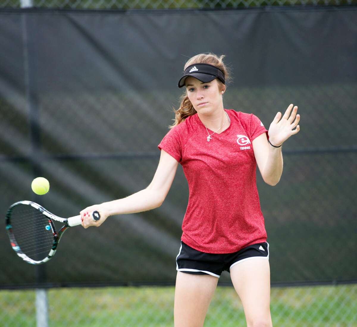 SIUE freshman Callaghan Adams hits a return shot. Adams is 16-11 in singles and 8-13 in doubles in her first season with the Cougars.