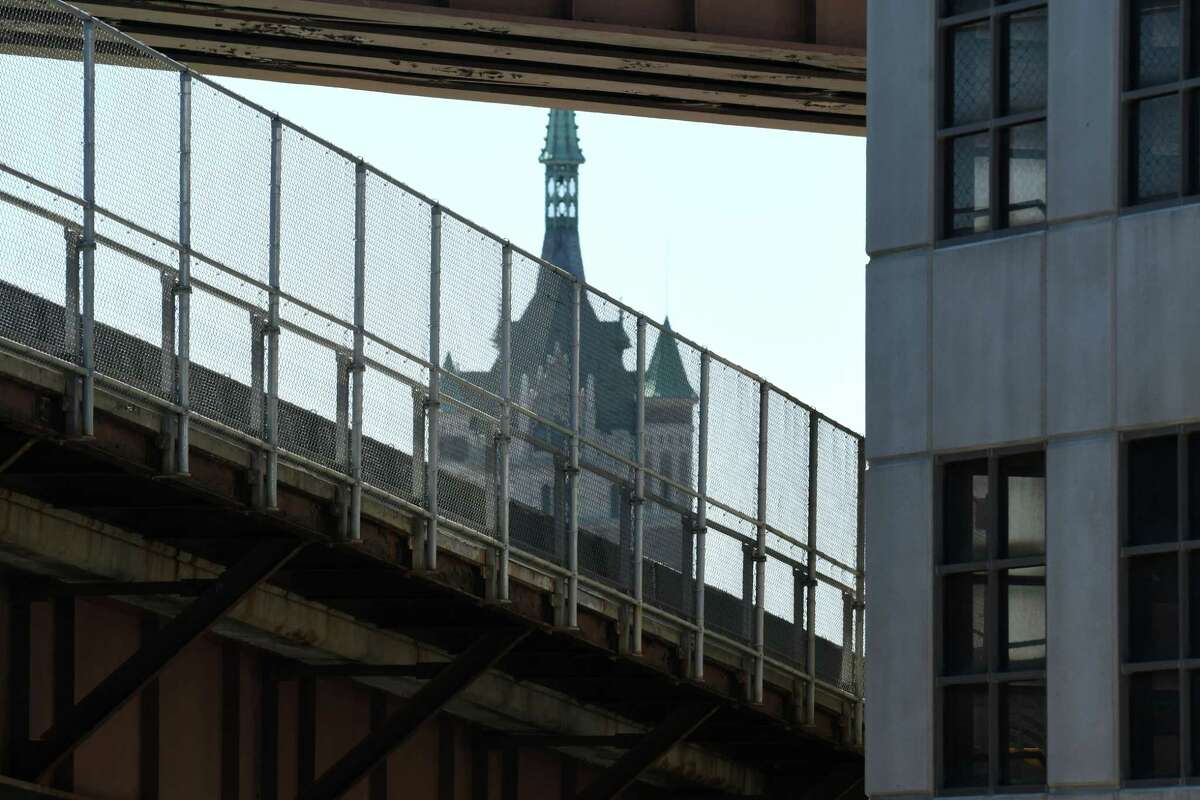 The SUNY System Administration Building is pictured behind a pedestrian bridge that connects the parking lots between Broadway and I-787 just north of the DEC building on Tuesday, April 18, 2017, in Albany, N.Y. The bridge was closed abruptly after an inspection revealed problems. Work will take an estimated six months, OGS reports. (Will Waldron/Times union)