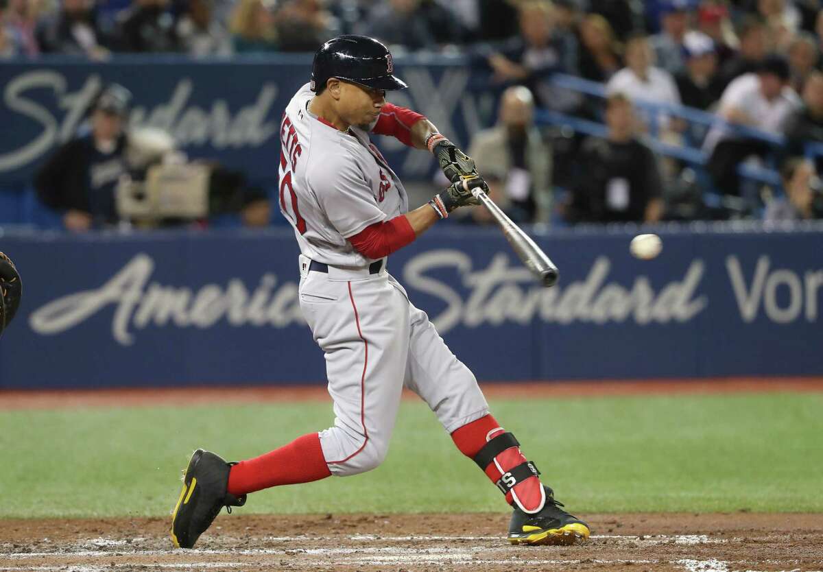 Toronto Blue Jays' Devon Travis hits an RBI single during the