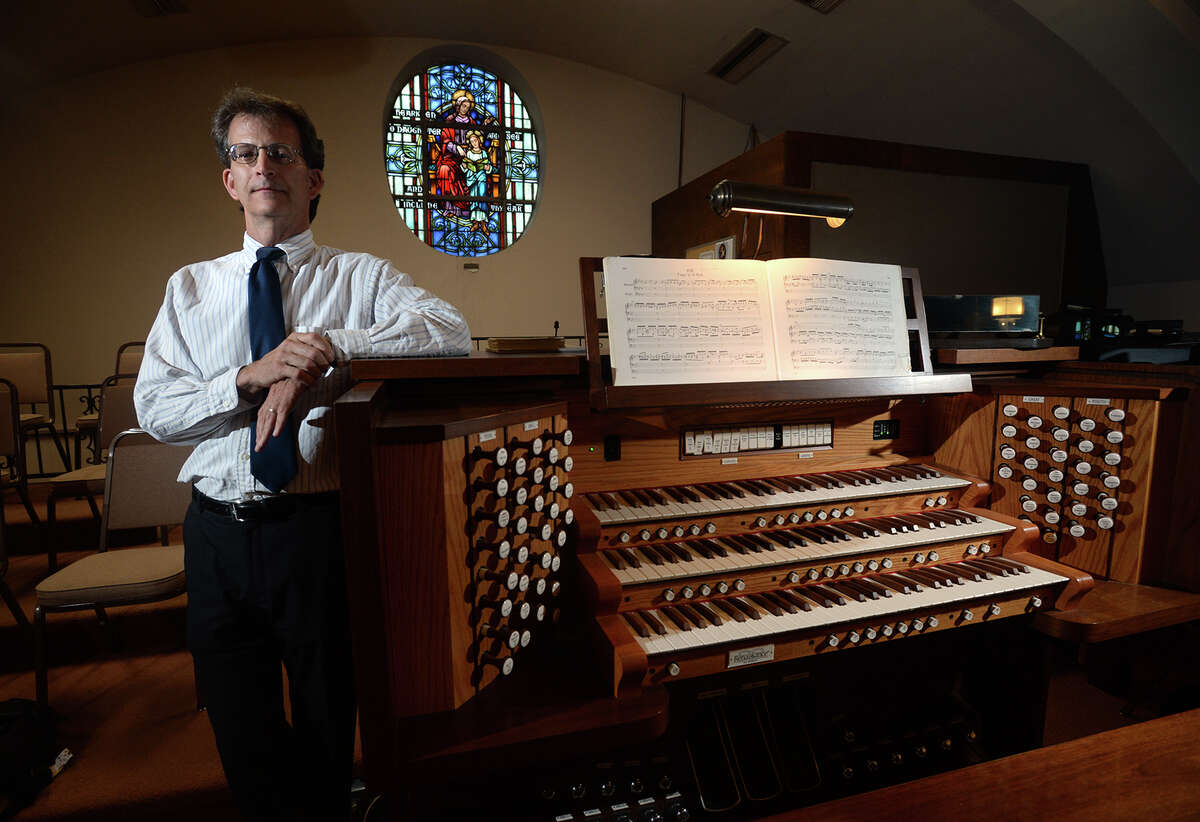 One of the few organists in the area, Scott Feldhausen performs for services at St Anne's Church in Beaumont. Photo taken Tuesday, April 18, 2017 Guiseppe Barranco/The Enterprise