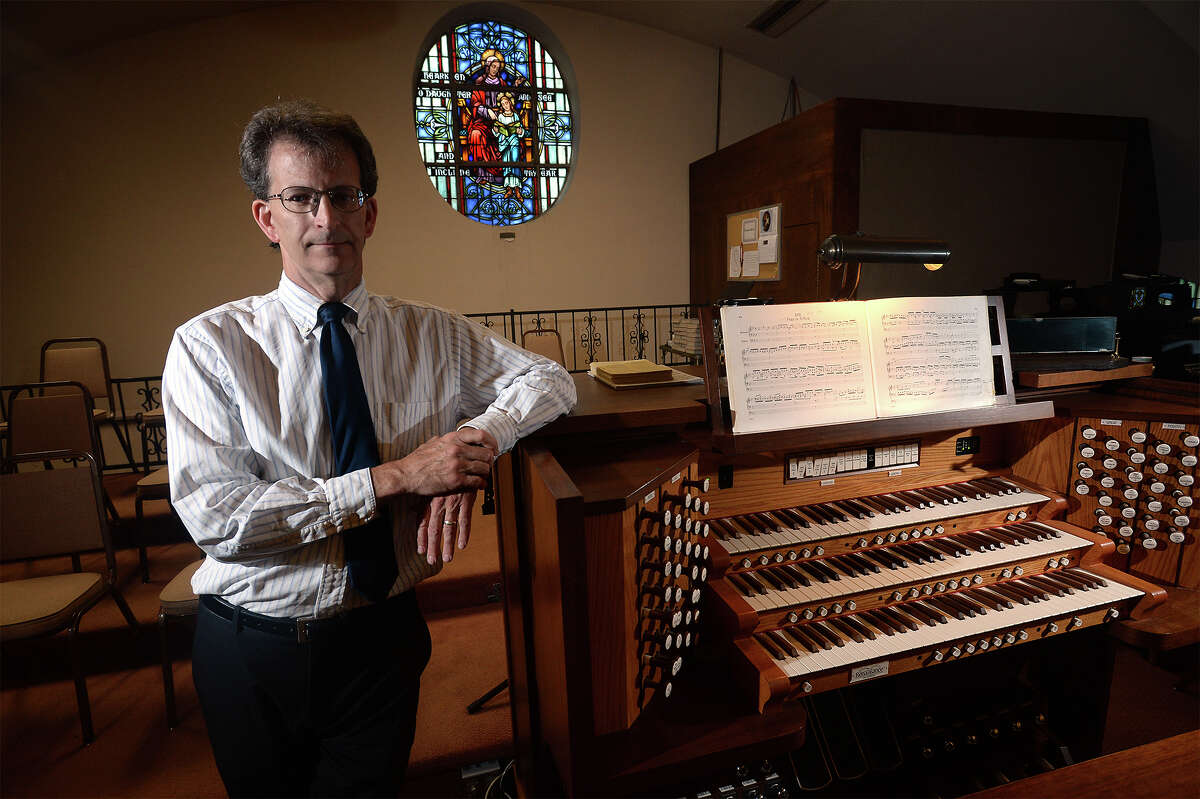 One of the few organists in the area, Scott Feldhausen performs for services at St Anne's Church in Beaumont. Photo taken Tuesday, April 18, 2017 Guiseppe Barranco/The Enterprise