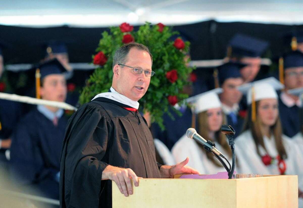 FILE — Thomas Main, head of King Low Heywood Thomas School, speaks during the commencement at the school in Stamford, Conn., Friday, May 29, 2015.