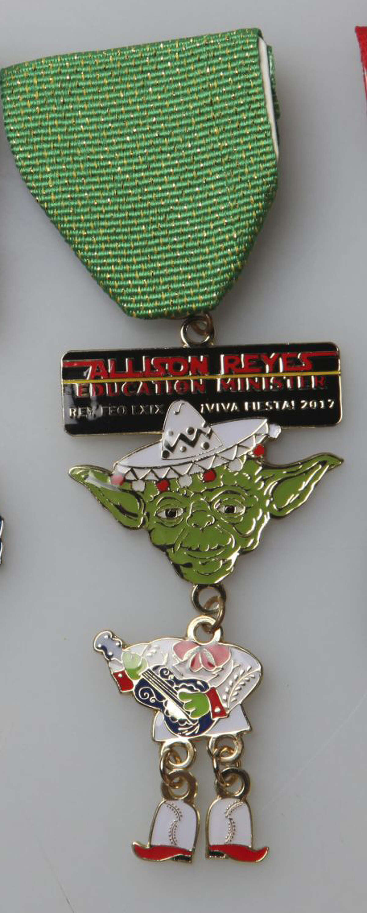 Rey Feo Education Minister Allison Reyes's medal shows Yoda.