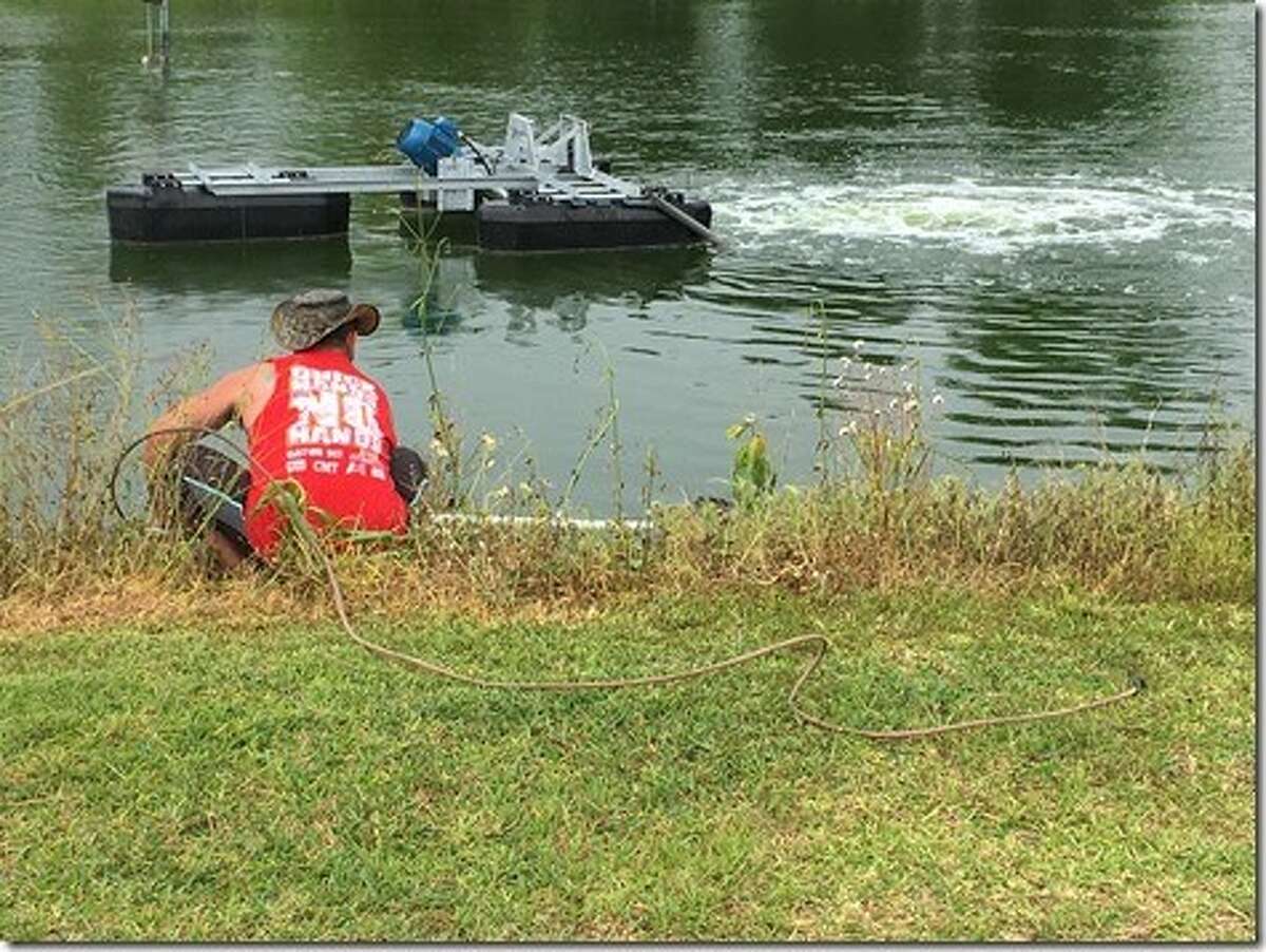 Gator County gator wranglers rescue an alligator hanging out in a Pinehurst retention pond Tuesday, April 18, 2017.