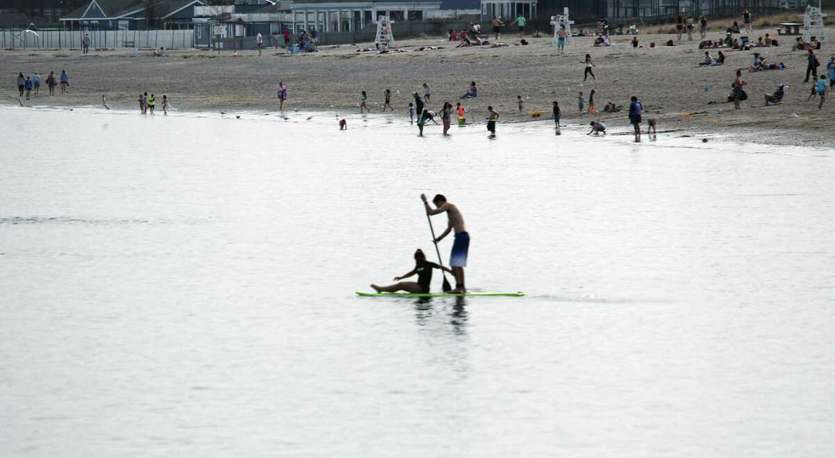 A paddle board duo takes to the water at Jennings Beach on April 11.