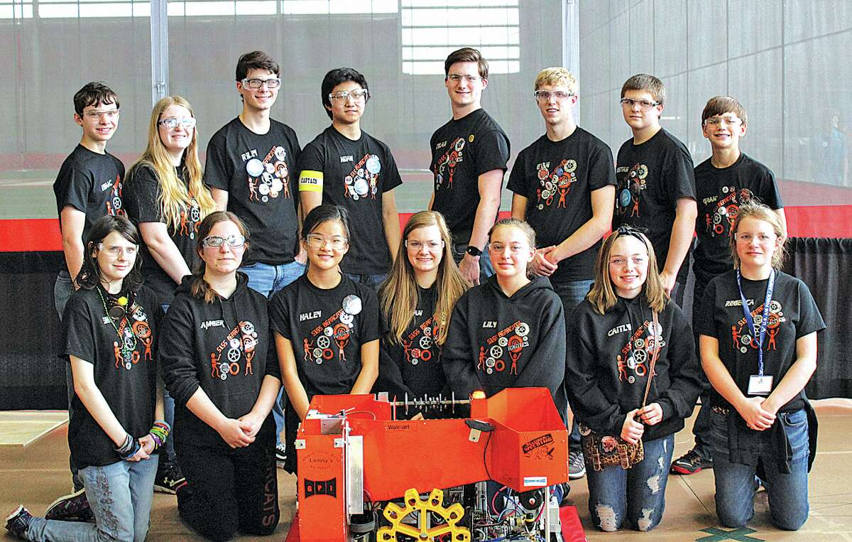   5155 Team members pose with their robot at the Michigan State Finals held at SVSU. Team members are (front row, left to right) Shay Rich, Amber Essenmacher, Haley Krueger, Megan Leppek, Lily Kieliszewski, Caitlyn Maurer and Rebecca Particka. (Back row, left to right) Isaac Booms, Chelsea Holdwick, Riley Murray, Noah Krueger, Dylan Hagen, Evan Franzel, Christian Gezequel and Grant Geiger.
