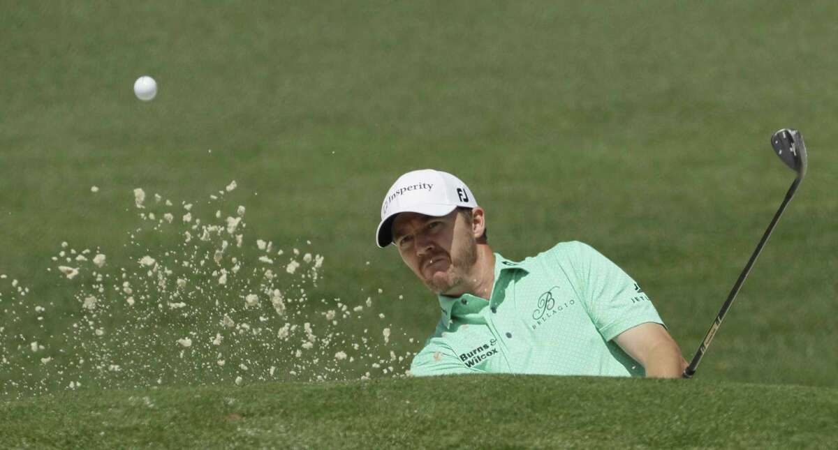 Jimmy Walker hits from a bunker on the second hole during the third round of the Masters on April 8, 2017, in Augusta, Ga.