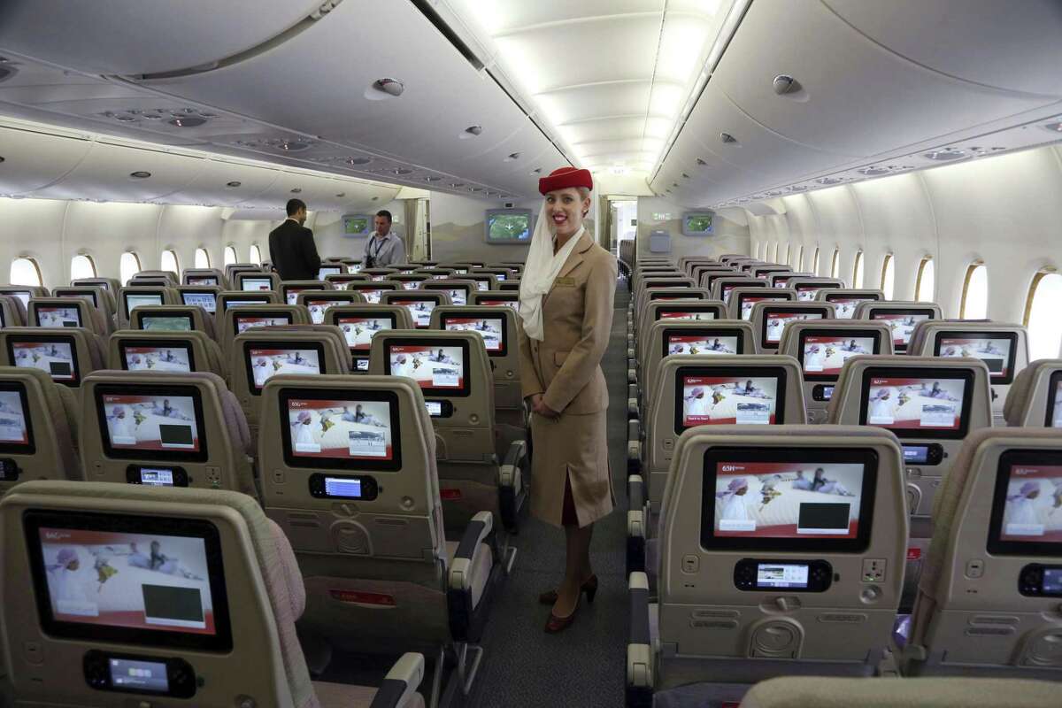 A stewardess stands inside an Emirates A380 aircraft. Emirates slashed its flights to the United States by 20 percent Wednesday.
