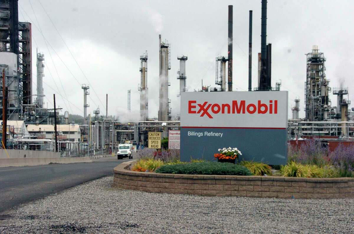 FILE - This Wednesday, Sept. 21, 2016, file photo shows Exxon Mobil's Billings Refinery in Billings, Mont. Exxon Mobil promotes longtime insider Darren Woods to replace Rex Tillerson as CEO. The vacancy was created when President-elect Donald Trump announced he will nominate Tillerson to become secretary of state. Analysts expect that change in the top office wonÃ©¢ÂÂt alter ExxonÃ©¢ÂÂs strategy or operations. (AP Photo/Matthew Brown, File)