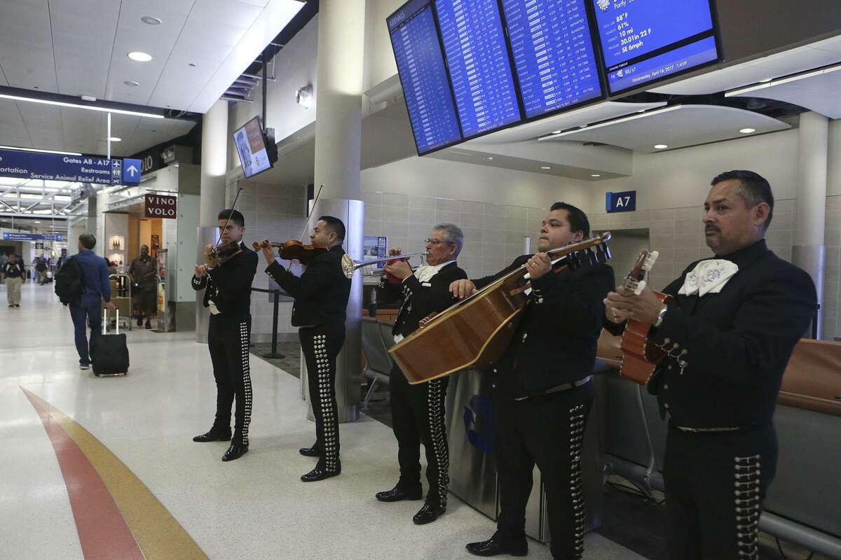 Mariachi Los Galleros de San Antonio performs Wednesday April 19, 2017 at the San Antonio International Airport. Mariachi bands and other forms of entertainment such balloon artist and a caricature artist are visting diffrent areas of the airport during this Fiesta time frame.
