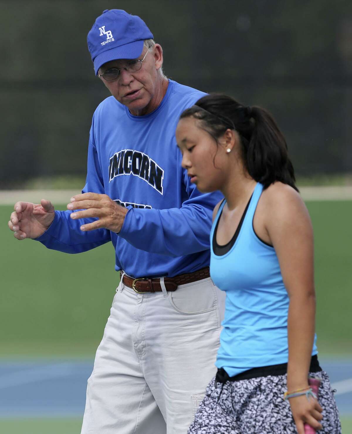 New Braunfels’ Sammi Gillas listens to coach David Mueller (left) on April 19, 2017 during the girls singles competition at the Region IV-6A tennis tournament at the McFarlin Tennis Center.