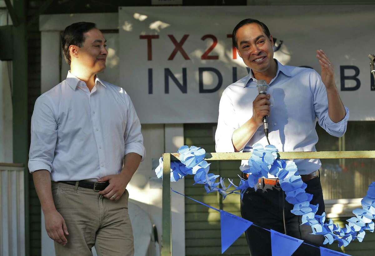 Former HUD Secretary Julian Castro (right) introduces his twin sibling Rep. Joaquin Castro (D-Texas) at a "Call to Action" townhall rally hosted by TX21 Indivisible where hundreds gathered to hear the Castros speak about the current state of political affairs in Texas and in the country on Wednesday, Apr. 19, 2017. TX21 Indivisible is made up of constituents from Texas' 21st Congressional District who are opposed to the Trump administration. Congressman Castro did not definitively indicate if he would run against Senator Ted Cruz but said he may have an answer in the near future. (Kin Man Hui/San Antonio Express-News)