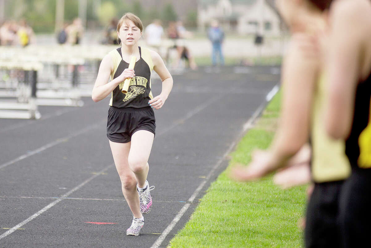 ERIN KIRKLAND | ekirkland@mdn.net Bullock Creek's Bailie Gagne competes in the 3,200-meter relay in Wednesday's meet against Chesaning and Swan Valley.