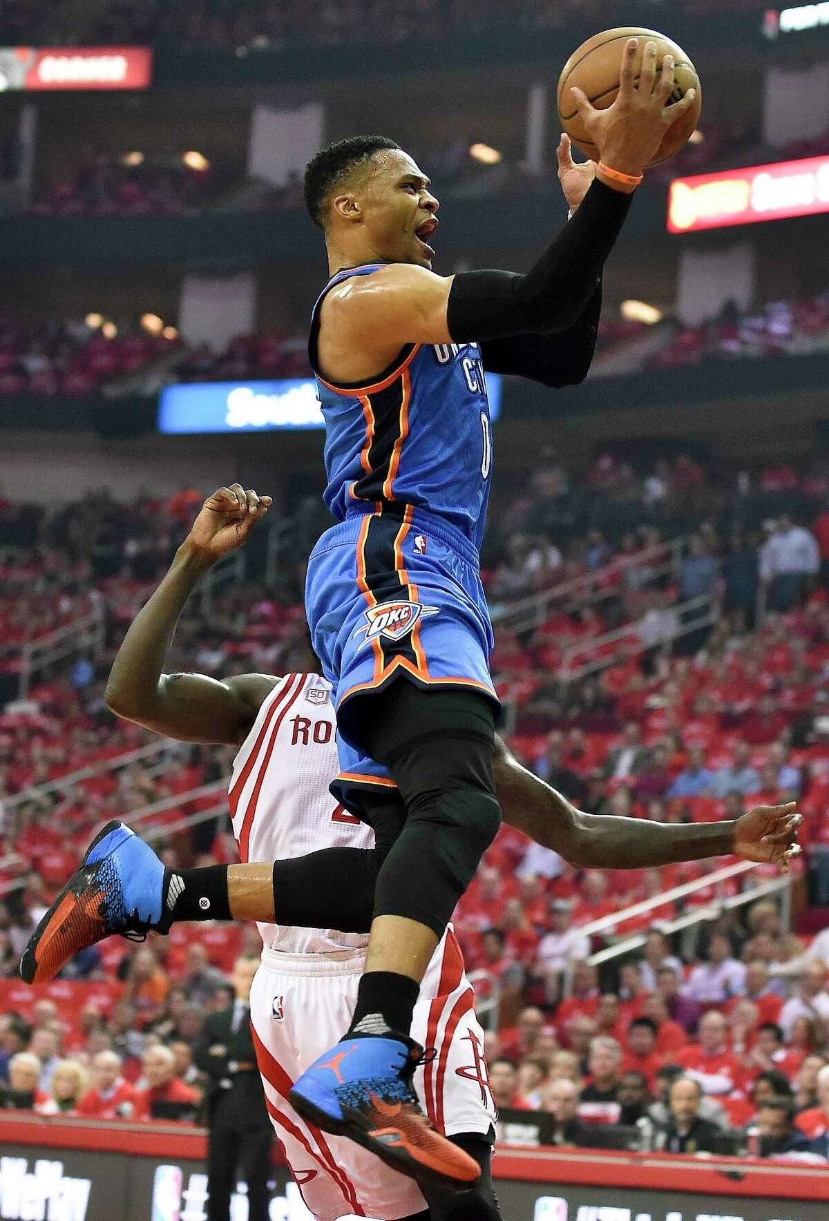 Oklahoma City Thunder guard Russell Westbrook drives past Houston Rockets guard Patrick Beverley during the first half in Game 2 of an NBA basketball first-round playoff series, Wednesday, April 19, 2017, in Houston. (AP Photo/Eric Christian Smith)