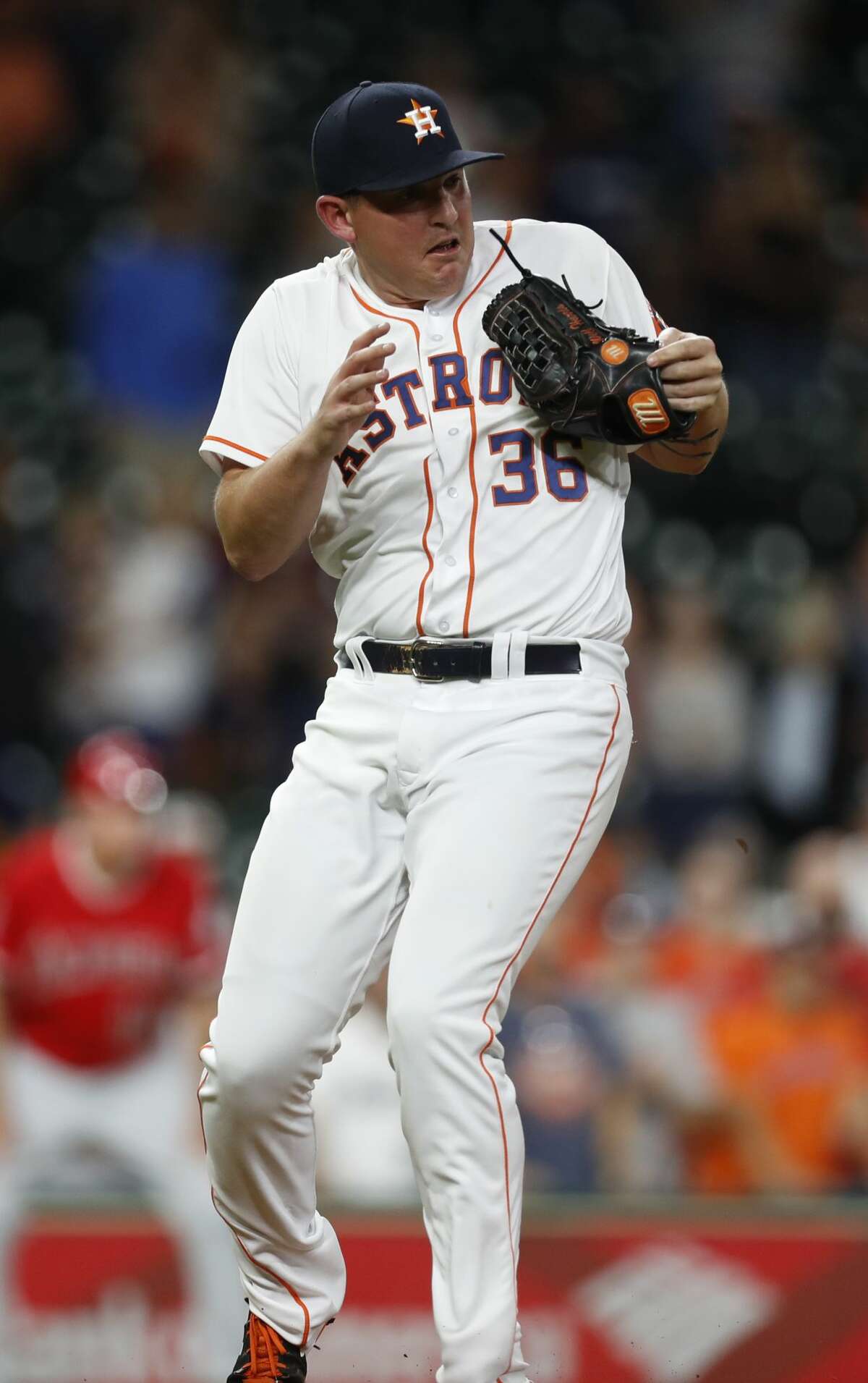 Houston Astros relief pitcher Will Harris (36) catches Los Angeles Angels Andrelton Simmons' sharply hit line drive for the final out of an MLB baseball game at Minute Maid Park, Wednesday, April 19, 2017, in Houston. ( Karen Warren / Houston Chronicle )