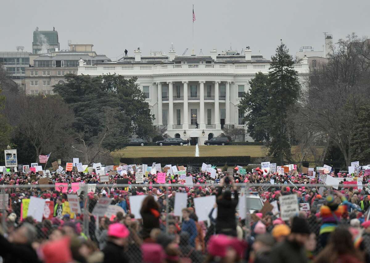 Demonstrators protest near the White House in Washington, DC, for the Women's March on January 21, 2017.