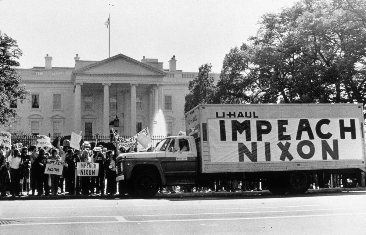 A demonstration outside the Whitehouse in support of the impeachment of President Nixon following the Watergate revelations in 1974.