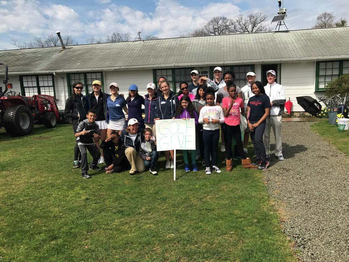 A group of volunteers and participants at an April 12, 2017 Golf to Give clinic at Longshore Golf Course.