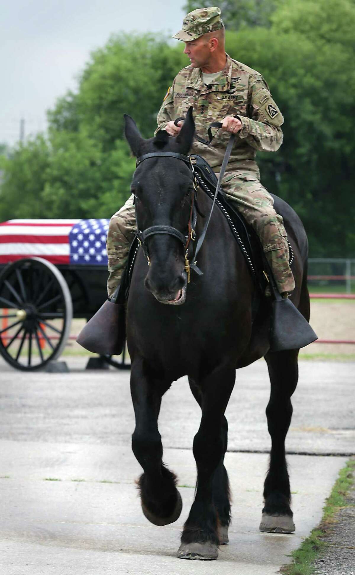 Lt. Gen. Jeffrey Buchanan, commander of U.S. Army North, rides Preston, a horse with the Caisson Section of Joint Base San Antonio- Fort Sam Houston. Buchanan will be the first general on horseback in the Battle of Flowers Parade since Gen. John Pershing in 1917, a festival spokesman said.