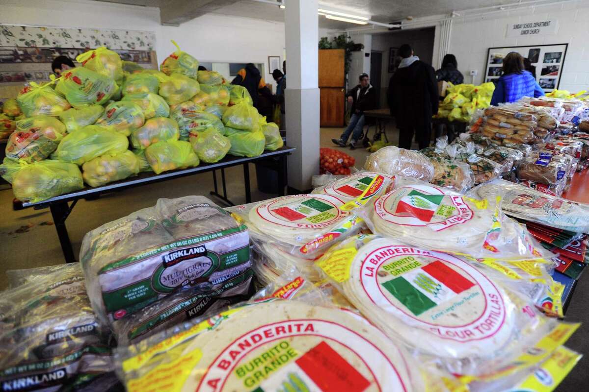 Bags of organized food and packages of bread sits waiting to be taken inside the Wilson Food Pantry in Stamford, Conn. on Thursday, March 30, 2017.