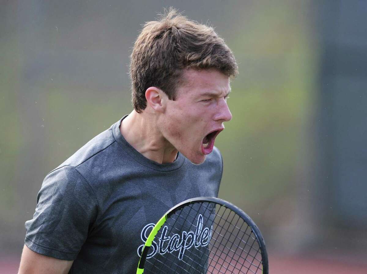 Staples' Evan Felcher celebrates a point after a long volley in his No. 1 singles game in the high school boys tennis match between Greenwich and Staples at Greenwich High School in Greenwich, Conn. Thursday, April 20, 2017.
