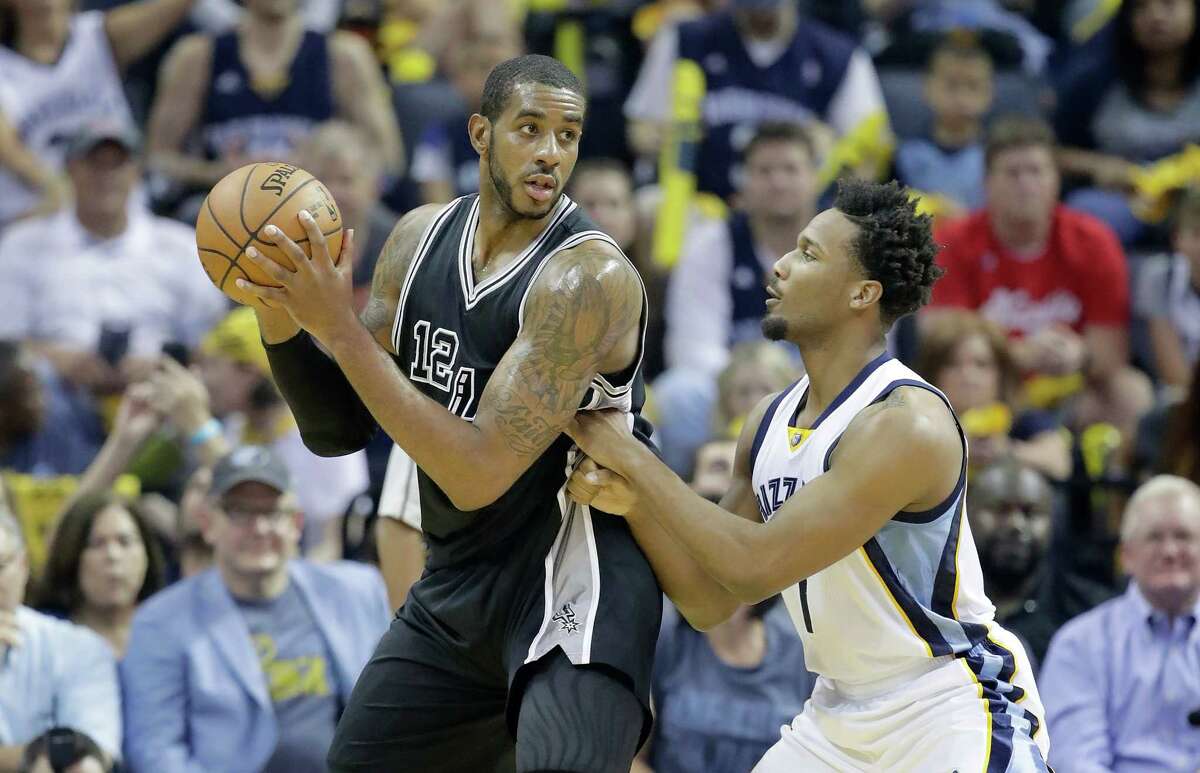 MEMPHIS, TN - APRIL 20: LaMarcus Aldridge #12 of the San Antonio Spurs looks to shoot the ball while defended by Wayne Selden Jr.#7 of the Memphis Grizzlies in game three of the Western Conference Quarterfinals during the 2017 NBA Playoffs at FedExForum on April 20, 2017 in Memphis, Tennessee. NOTE TO USER: User expressly acknowledges and agrees that, by downloading and or using this photograph, User is consenting to the terms and conditions of the Getty Images License Agreement