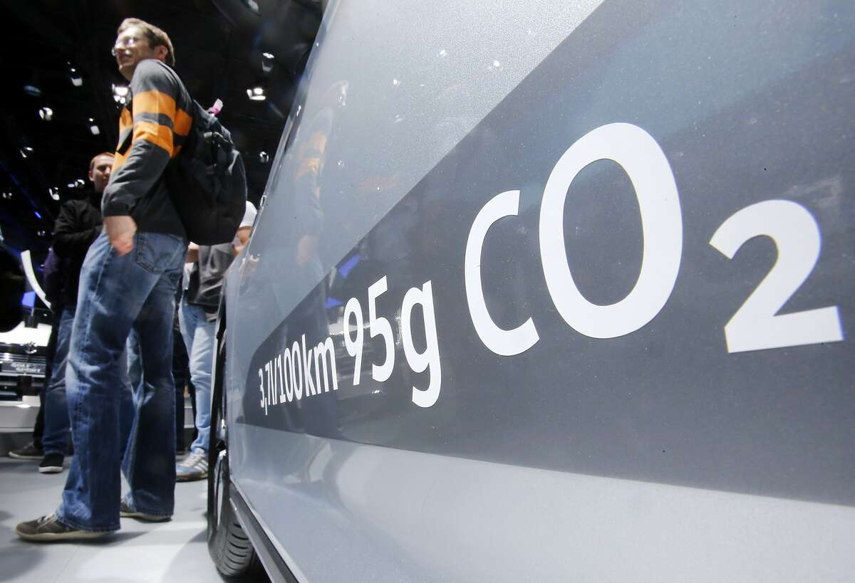 FILE - In this Sept. 22, 2015, file photo, the amount of carbon dioxide emissions is written on a Volkswagen Passat Diesel at the Frankfurt Car Show in Frankfurt, Germany. On Friday, April 21, 2017, a judge ordered Volkswagen to pay a $2.8 billion criminal penalty in the United States for cheating on diesel emissions tests, blessing a deal negotiated by the government for a �massive fraud� orchestrated by the German automaker. (AP Photo/Michael Probst, File)