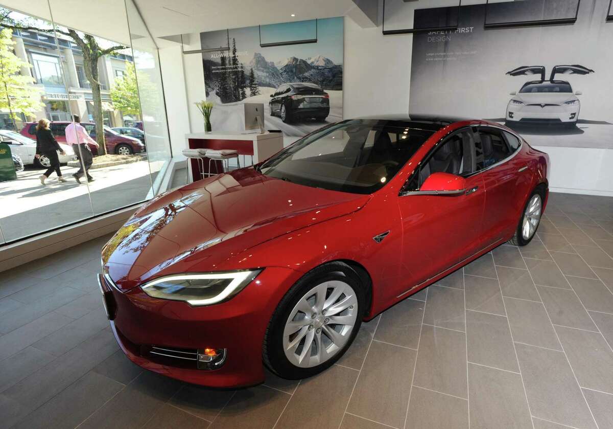 The official first day of business at the Tesla store located at 340 Greenwich Ave., Greenwich, Conn., Friday, Oct. 7, 2016. Tesla designs and manufactures premium electric vehicles.