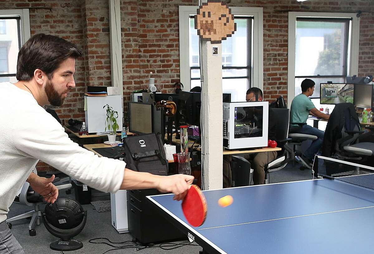 Product manager Jeff Gorndt plays ping pong when away from his computer at Forge, a video game company, on Friday, April 21, 2017, in San Francisco, Calif.