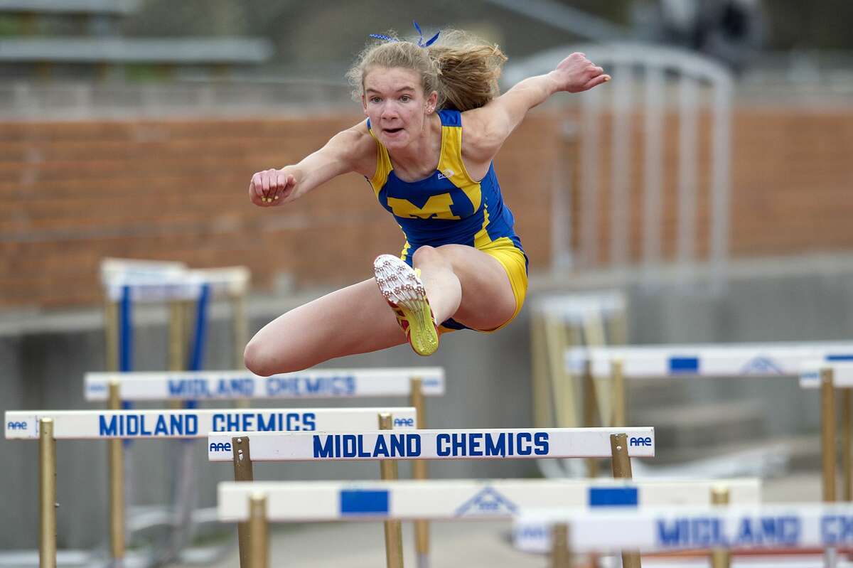 BRITTNEY LOHMILLER | blohmiller@mdn.net Midland's Sarah Maschino competes in the 100 hurdles shuttle during the Graves/Swayze Relays Friday afternoon at the Midland Stadium.