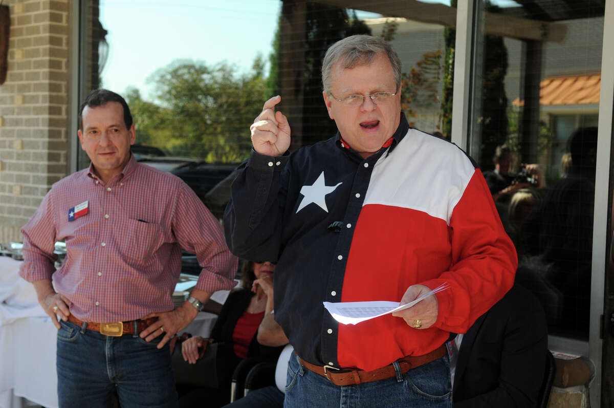 GOP candidate Paul Bettencourt, right, with fellow candidate Paul Simpson, speaks during a rally for voters and supporters of Senate District 7 (SD-7) on the patio of Hasta La Pasta in Spring on Saturday.