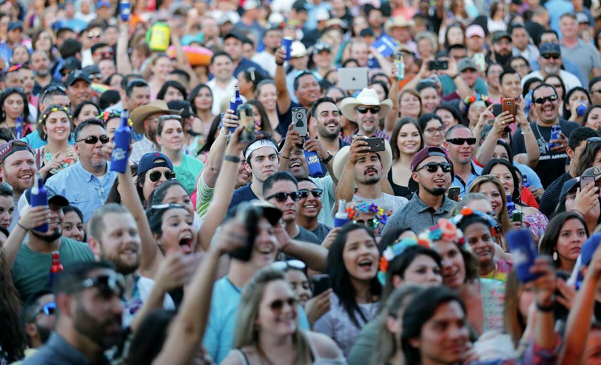 Crowds cheer at the 2017 Fiesta Oyster Bake on the St. Mary’s University campus. On Wednesday, St. Mary’s became the latest area university to announce it was closing its residence halls and moving courses online for the rest of the semester.