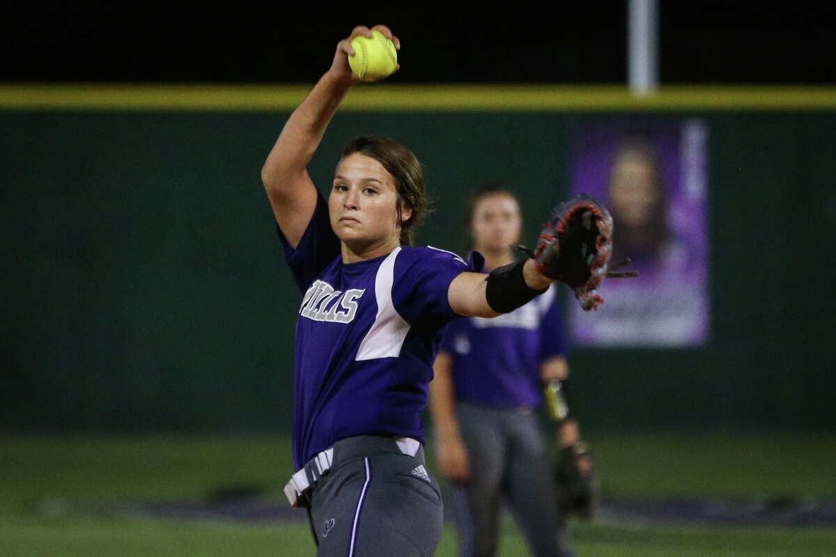 Willis' Casey Dixon (10) throws a warmup pitch during the varsity softball game against Waller on Friday at Willis High School.