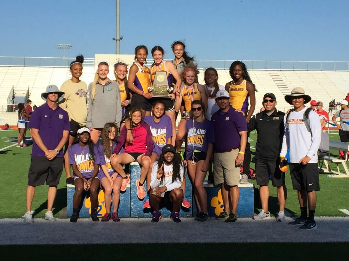 The Midland High girls track team poses with its first-place trophy after winning the team championship at the Districts 1-6A/2-6A area meet, Friday at Peoples Bank Stadium in Wolfforth.