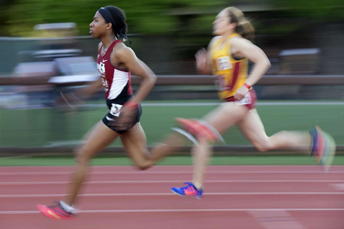 Stanford sprinter Olivia Baker, left, outdistances an opponent in a heat of the women's 800 meters during the Cardinal Classic at Angell Field, Friday, April 21, 2017, in Stanford, Calif.