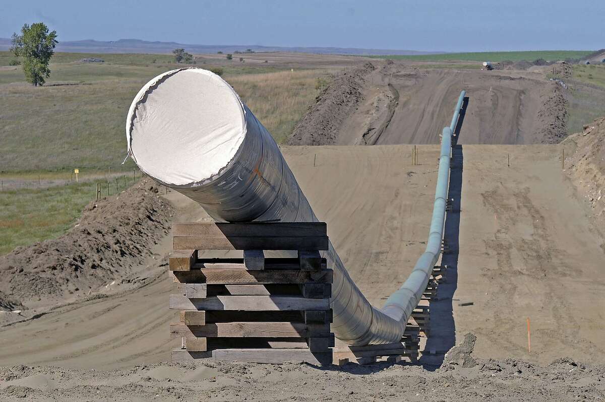FILE - This Sept. 29, 2016, file photo, shows a section of the Dakota Access Pipeline under construction near the town of St. Anthony in Morton County, N.D. The Army has notified Congress Tuesday, Feb. 7, 2017, that it will allow the $3.8 billion Dakota Access pipeline to cross under a Missouri River reservoir in North Dakota, completing the four-state project to move North Dakota oil to Illinois. The Army intends to allow the crossing under Lake Oahe as early as Wednesday, Feb. 8. The crossing is the final big chunk of work on the pipeline. (Tom Stromme/The Bismarck Tribune via AP, File)