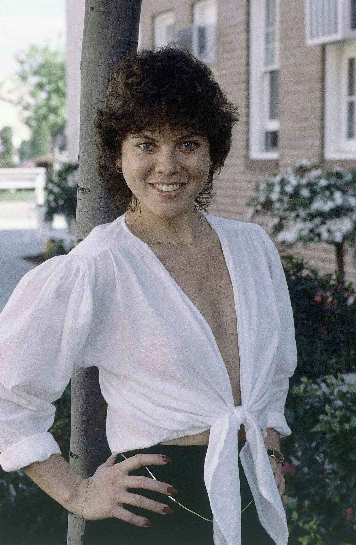 FILE - This Feb. 19, 1982 file photo shows actress Erin Moran of the television show, "Happy Days" in Los Angeles. Moran, the former child star who played Joanie Cunningham in the sitcoms "Happy Days" and "Joanie Loves Chachi," has died at age 56. Police in Harrison County, Indiana said that she had been found unresponsive Saturday, April 22, 2017, after authorities received a 911 call. (AP Photo/Wally Fong, File)