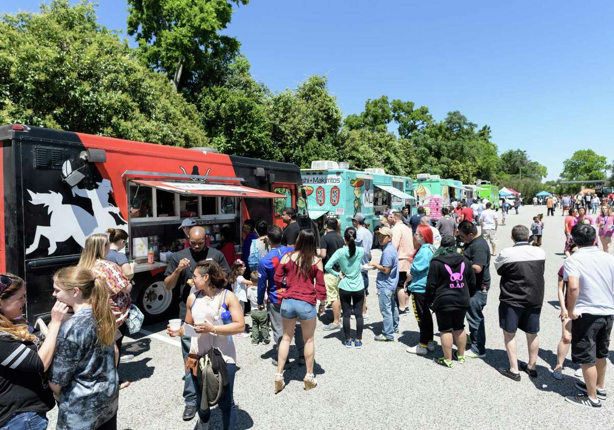 Customers strolling the Food Truck strip looking for the right lunch at the 5th Annual Temple Sinai West Houston Food Truck Festival on Sunday, April 23, 2017 in Houston Texas.