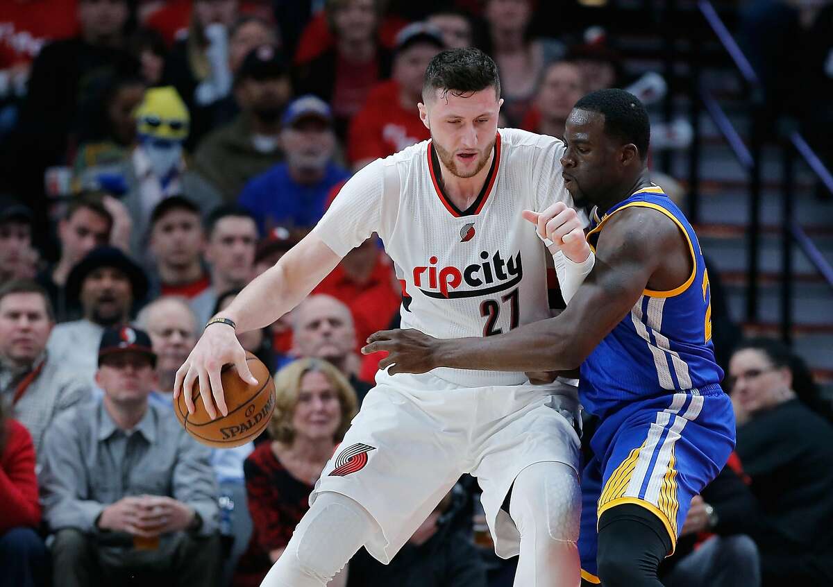 PORTLAND, OR - APRIL 22: Jusuf Nurkic #21 of the Portland Trail Blazers is guarded by Draymond Green #23 of the Golden State Warriors during Game Three of the Western Conference Quarterfinals of the 2017 NBA Playoffs at Moda Center on April 22, 2017 in Portland, Oregon. NOTE TO USER: User expressly acknowledges and agrees that, by downloading and or using this photograph, User is consenting to the terms and conditions of the Getty Images License Agreement. (Photo by Jonathan Ferrey/Getty Images)