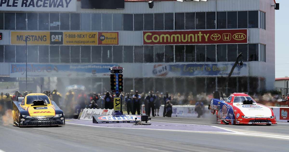 Funny Car driver Robert Hight (right) defeats J.R. Todd and advances to the semifinals at the 30th annual NHRA Spring Nationals at the Royal Purple Raceway on Saturday, April 23, 2017 in Baytown, TX.